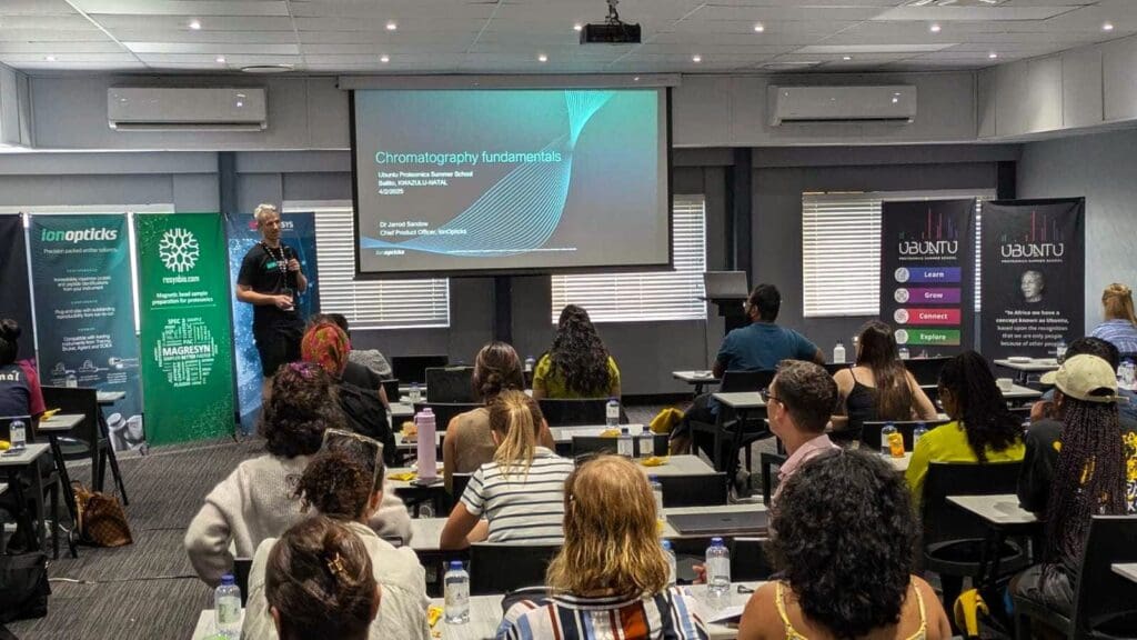Dr Jarrod Sandow presenting in front of students in a workshop. 