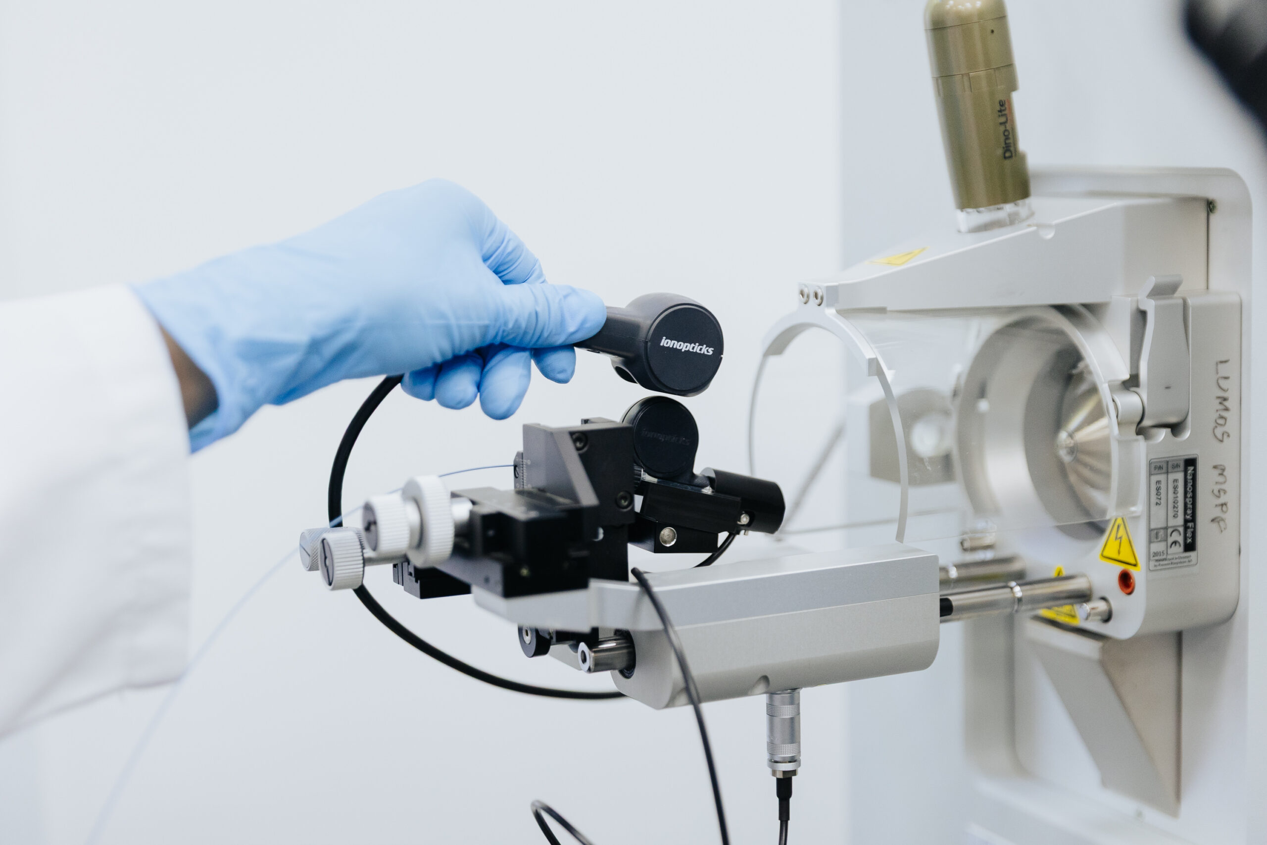 Scientist installing IonOpticks 5cm housing column into thermo mass spec